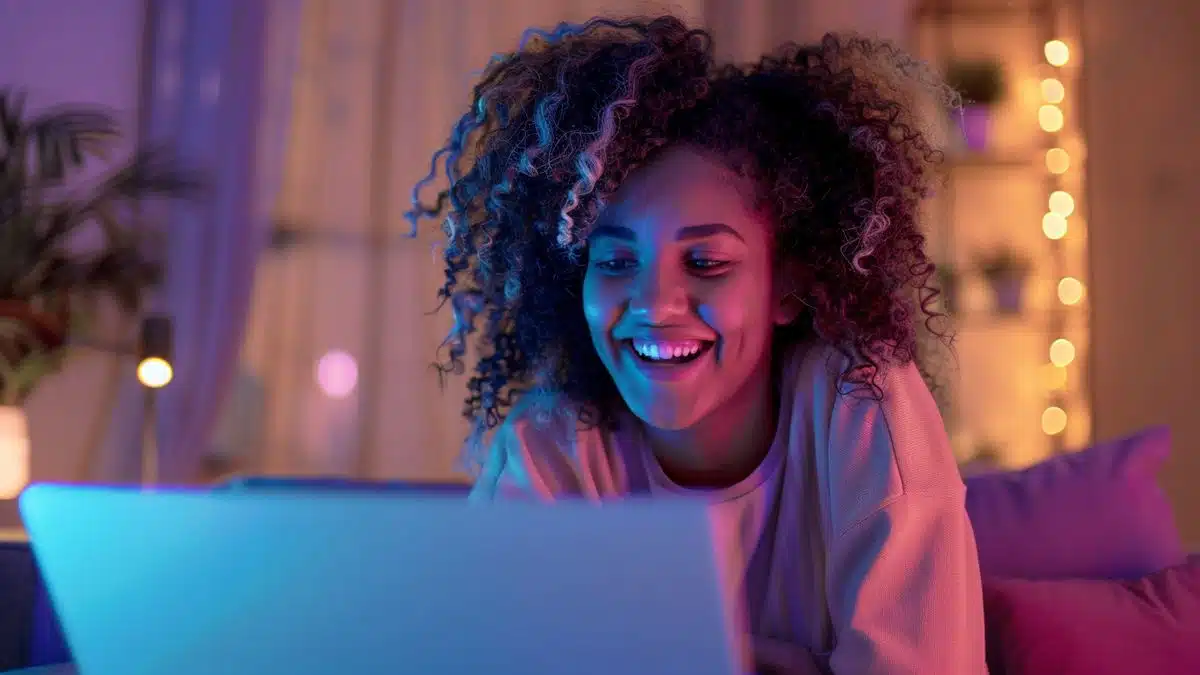 Person smiling while checking freed up disk space on their laptop.